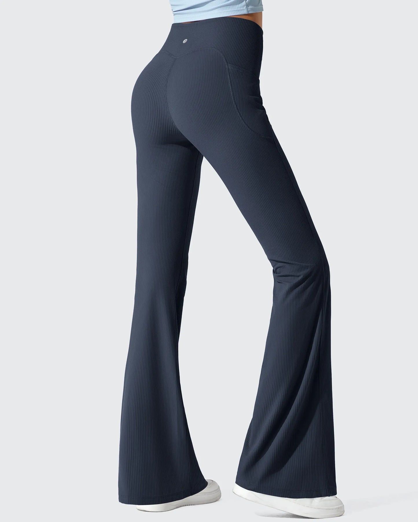 Leggings acanalados de tiro alto con bolsillos y corte de bota