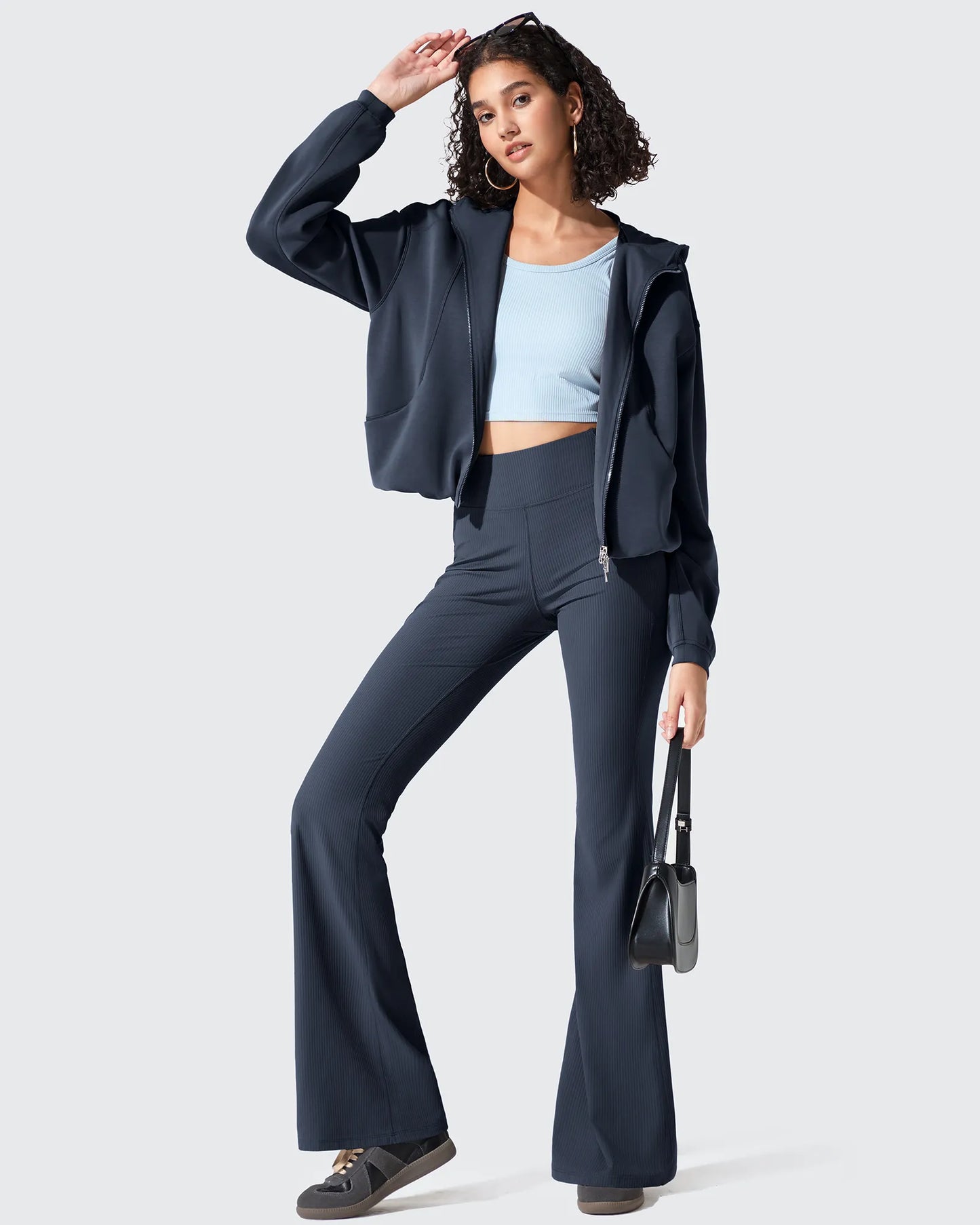 Leggings acanalados de tiro alto con bolsillos y corte de bota