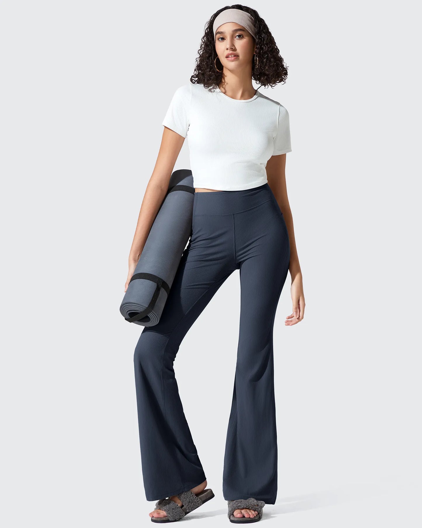 Leggings acanalados de tiro alto con bolsillos y corte de bota